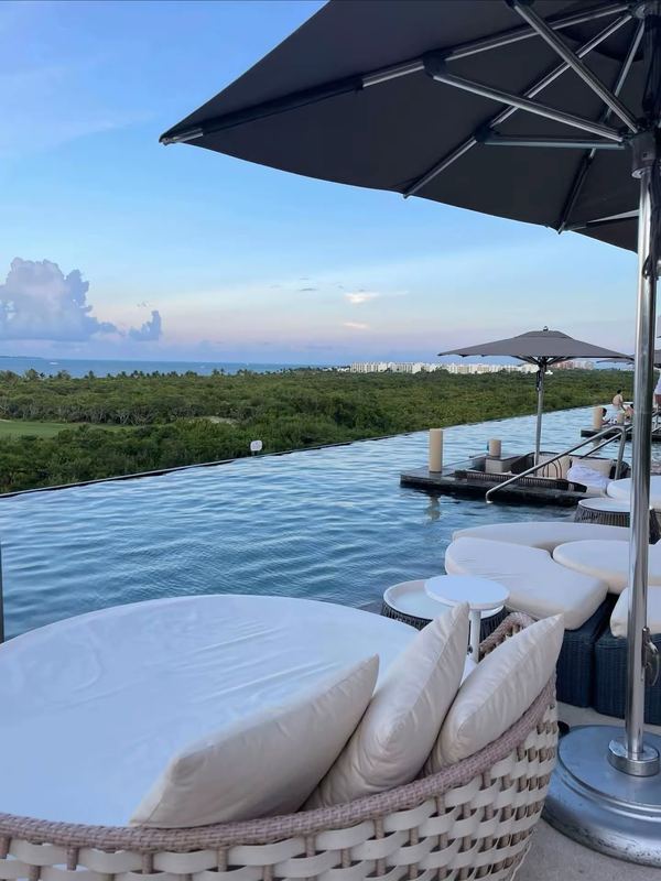 Infinity pool rooftop view at sunset