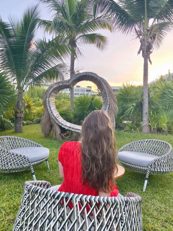 Resort garden with heart sculpture at sunset